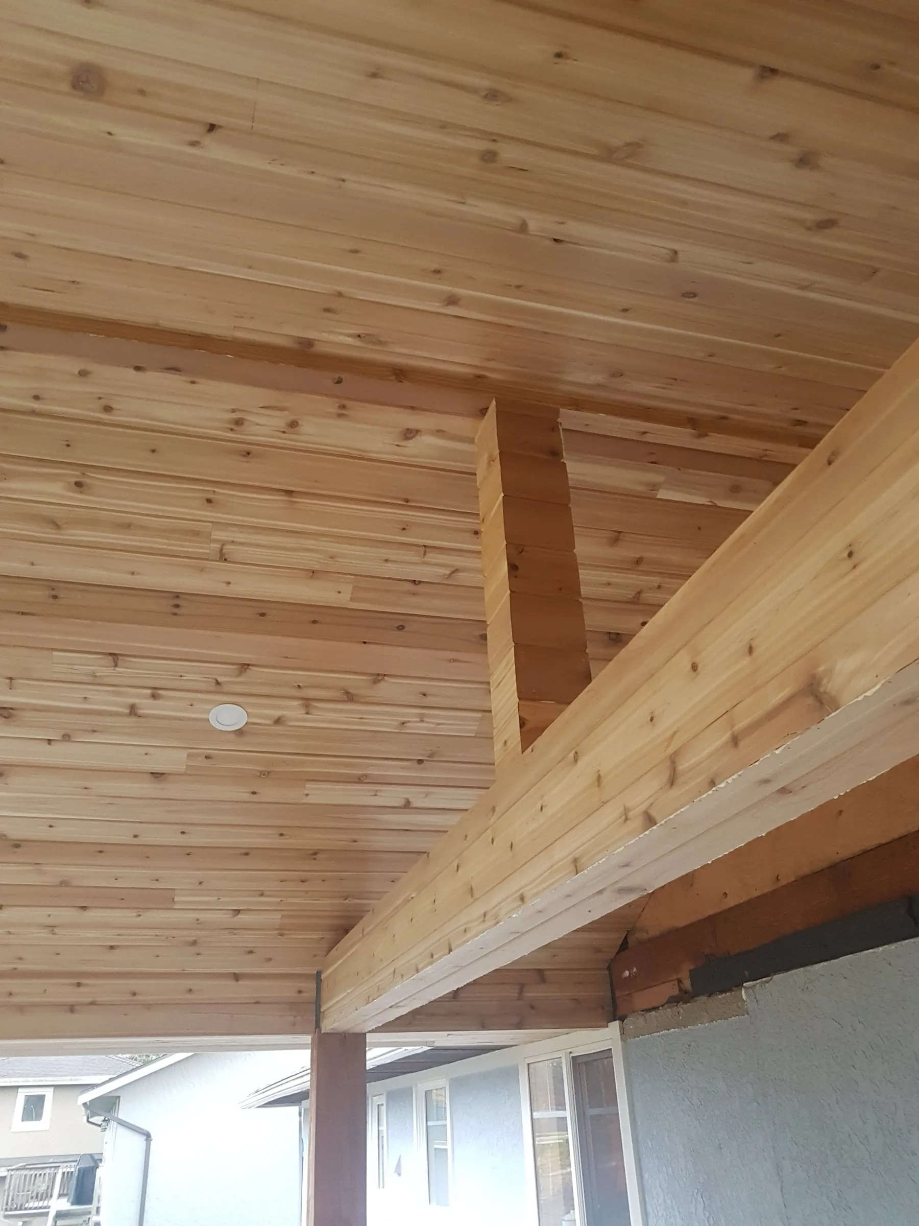 Cedar soffit and beam — Covered exterior
